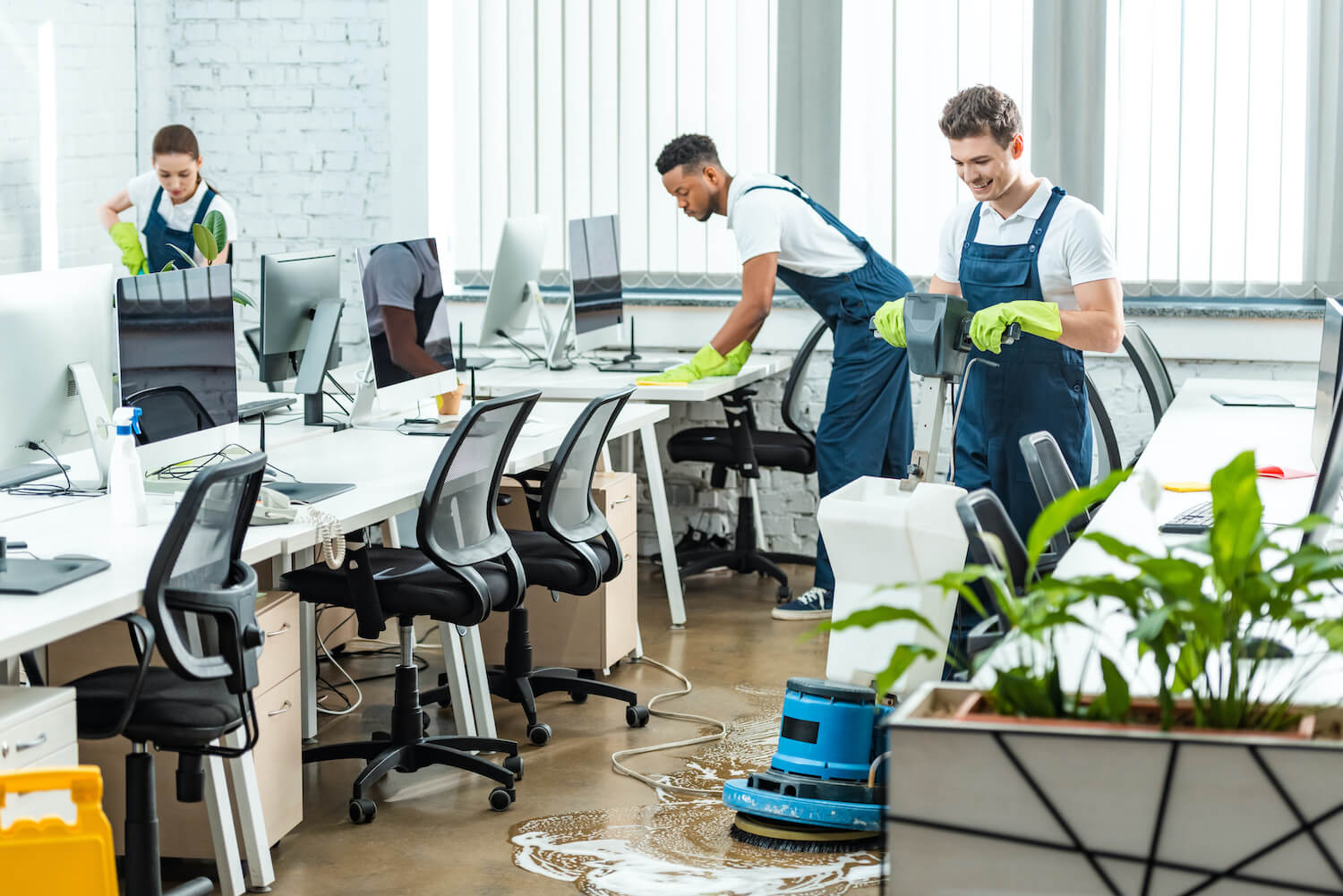 Commercial cleaning crew cleaning office